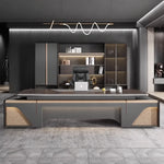 Stellan desk centered in a dark suite with lit shelving