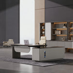 Tavren desk, left return, at sitting height by lit shelving
