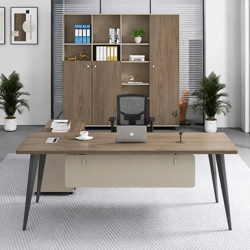 Tawn grand desk with side return in a fern-lined office