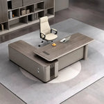 Teller desk from above, right return, cream chair on carpet