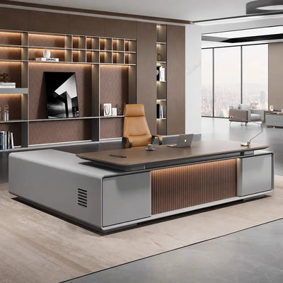 Twilley desk, right return, in a warm CEO office with lit shelving