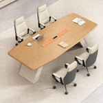 Unity 10′6″ (126-inch) meeting table seating 10 with four cream-and-orange chairs, angled overhead view