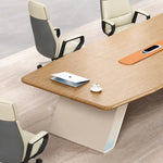 Unity conference table close up with a laptop, cream leather chairs and the powered orange strip