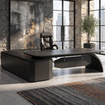 Ventura desk in a sunlit office with a city view