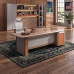 Walsh desk in cognac and gray in a night-city office