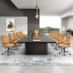 Winslow large conference table seating 12 in orange leather chairs on a pale blue rug