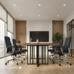 Wright meeting room table with black chairs facing a wall-mounted screen, slatted metal base visible
