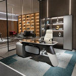 Zevran desk in a lit library office with white chair